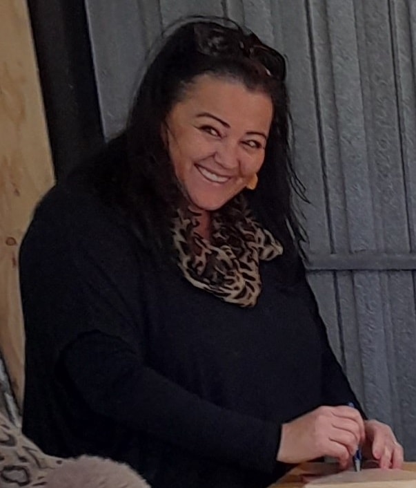 Lisa O punching holes for her shamanic drum