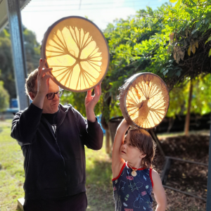 grand dad and grand son after making their own drums